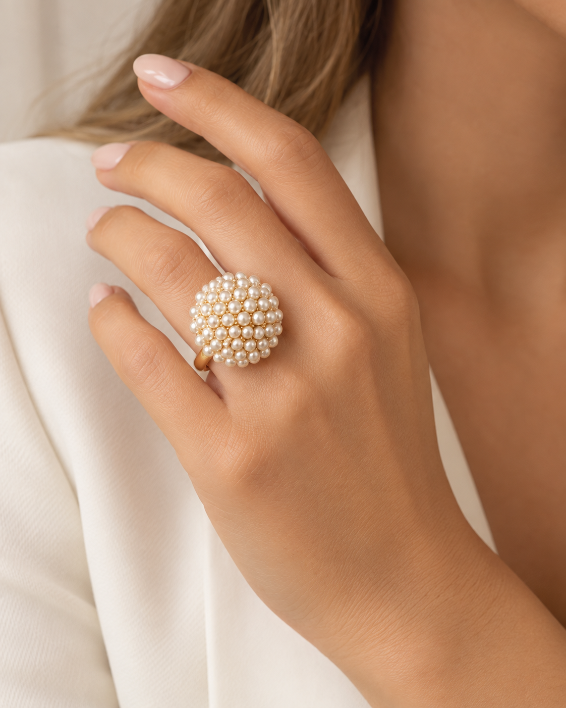 Model wearing COMPLIMENTI gold-plated pearl cluster adjustable ring