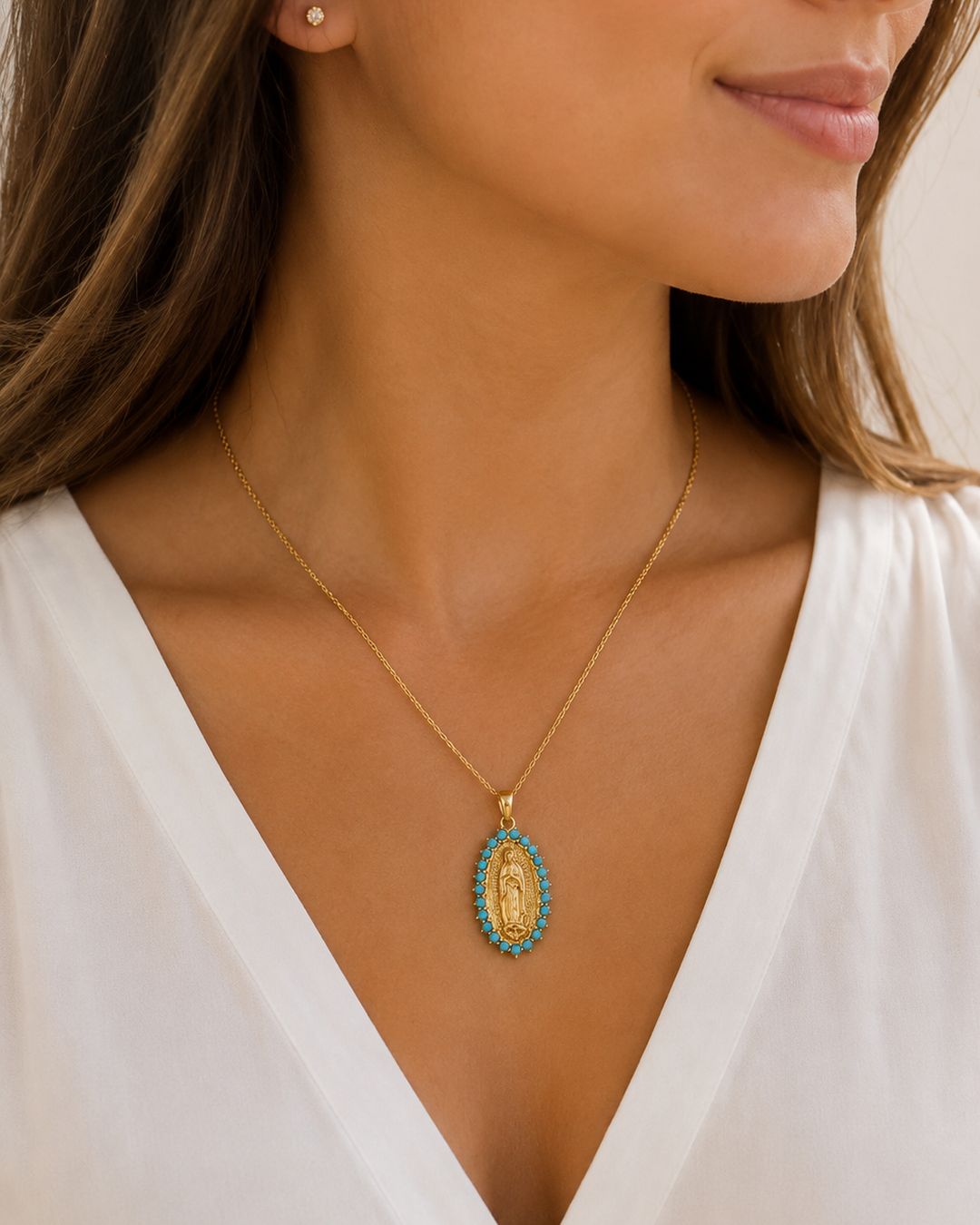 Model wearing COMPLIMENTI Gold-Plated Virgin of Guadalupe Turquoise Medal Necklace, 18 inch