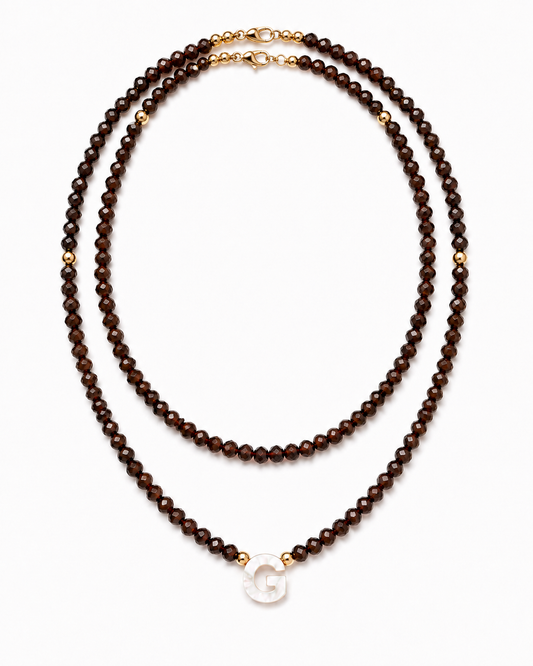Chocolate personalized double glass bead necklace set with mother-of-pearl initial on white background