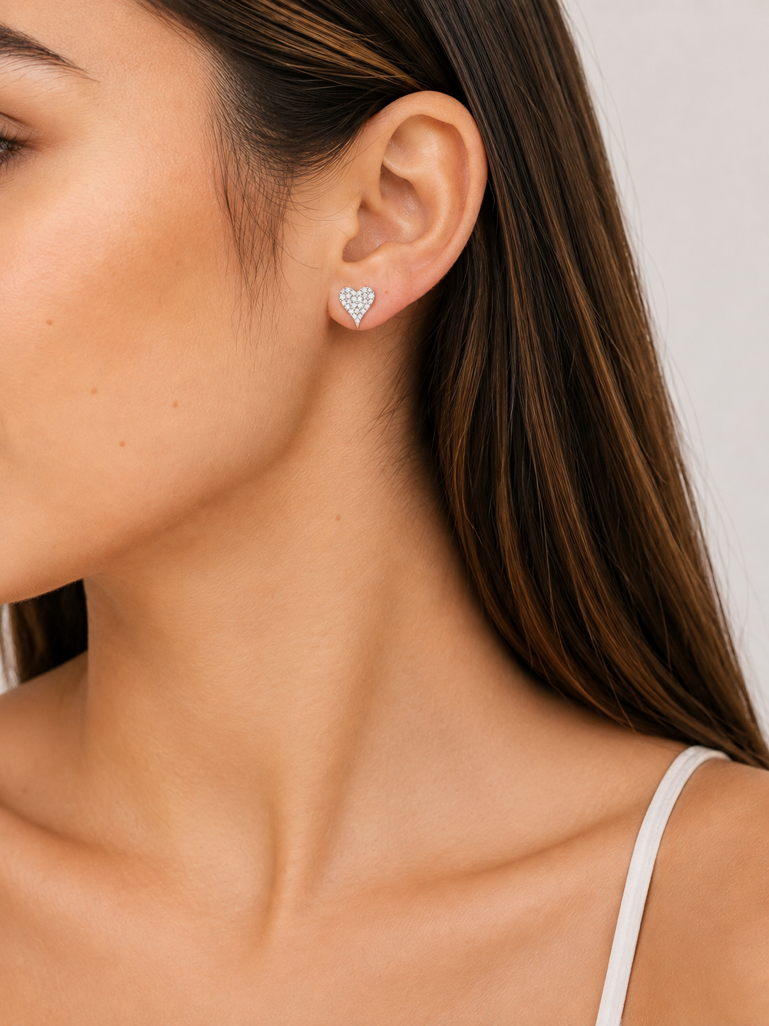 Heart CZ stud earrings in 925 sterling silver worn by model